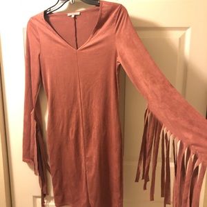 Blush pink dress with fringe sleeves.